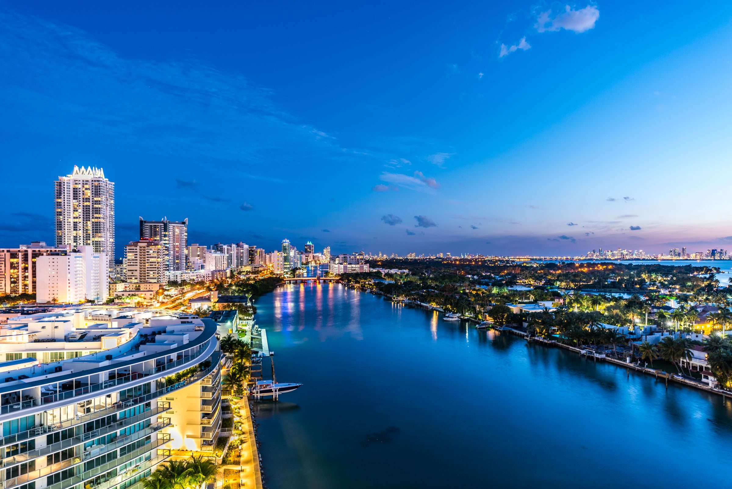 Miami Beach condominium towers along Indian Creek at dusk