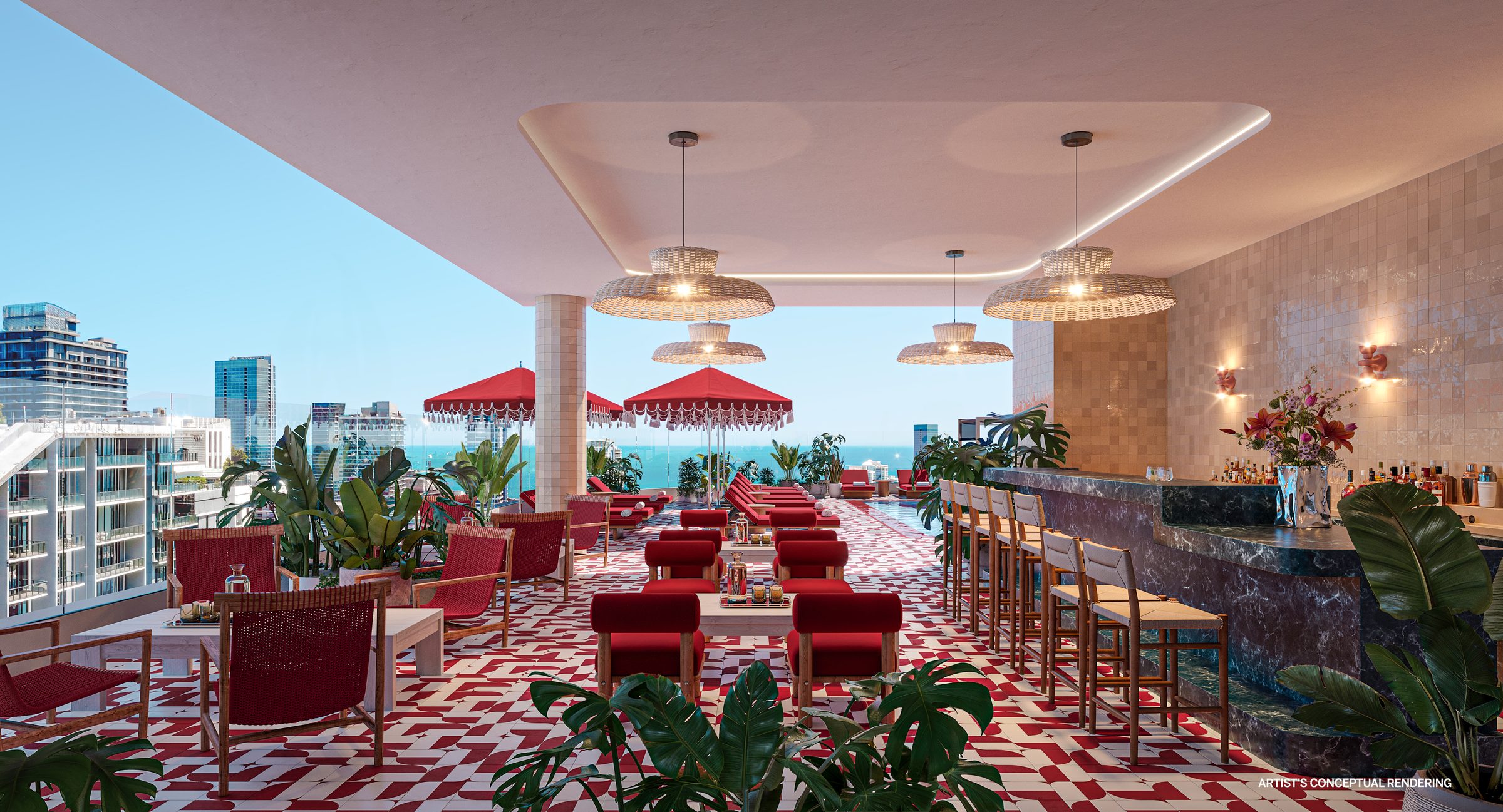 The covered rooftop bar and lounge, with red seating and a marble bar